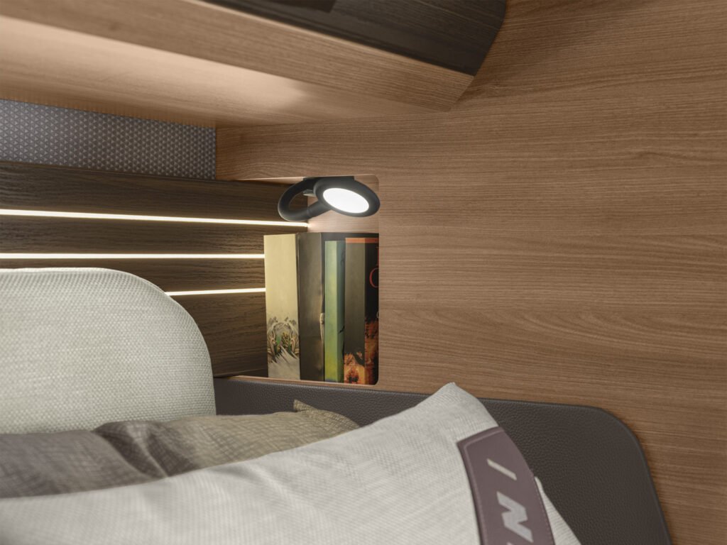 Obrázek interiéru ukazuje útulný prostor s osvětlením a knihami. Značka a model nejsou viditelné.